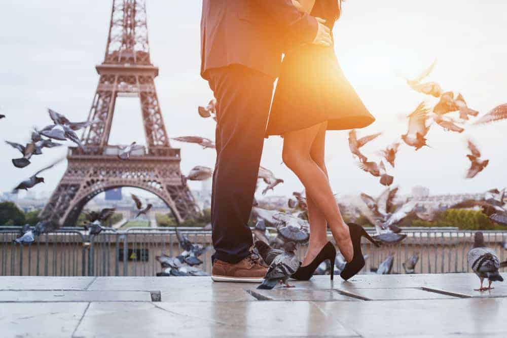 couple at sunrise on their paris honeymoon