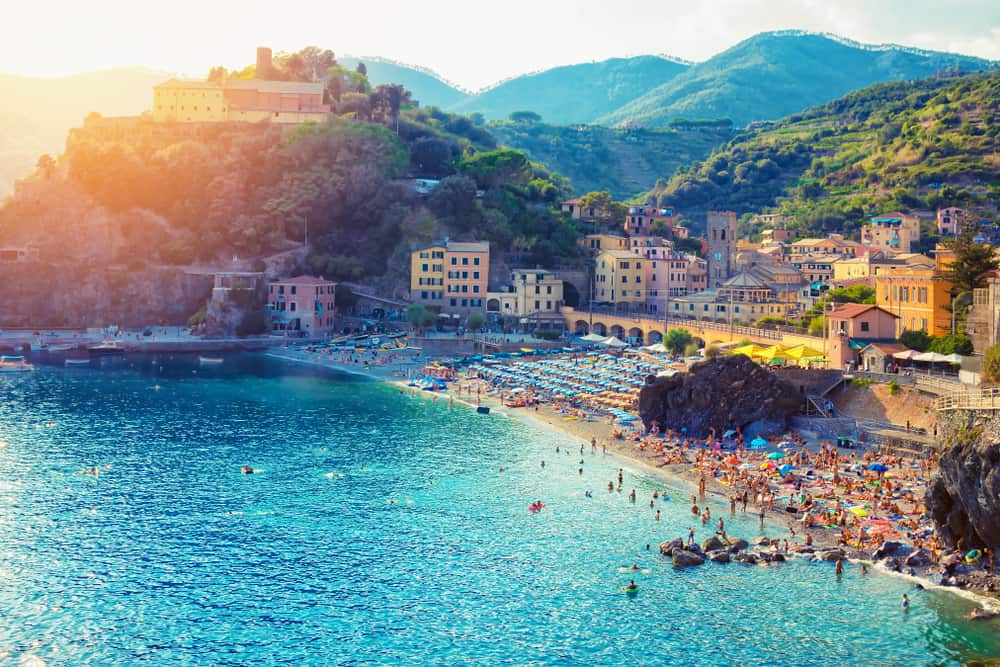 Photo of classic the Cinque Terre beach, Monterosso Vecchio beach, nestled among the buildings of historic downtown Monterosso 