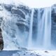 Skogafoss Waterfall with snow in Iceland in January