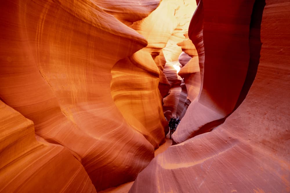 people in a narrow passageway at Lower Antelope Canyon