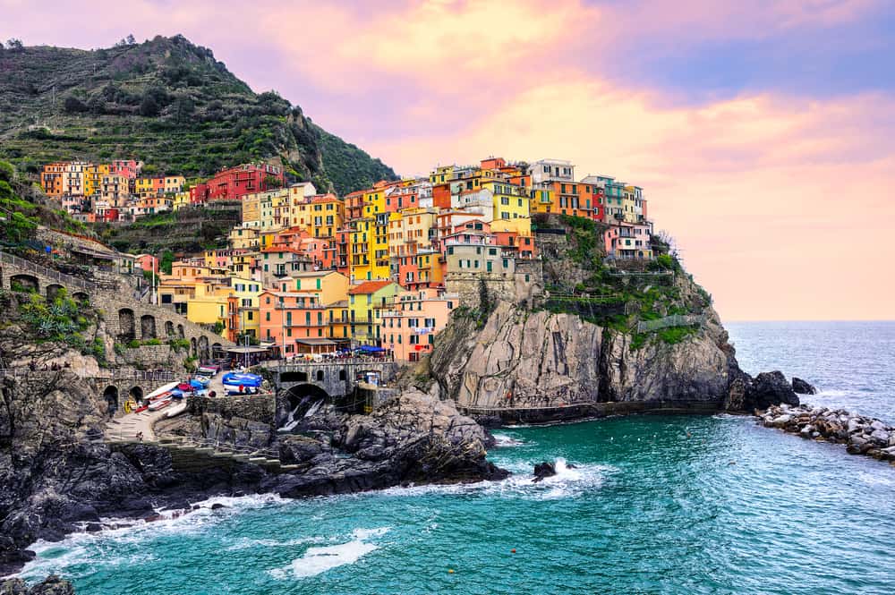 See some beautiful sunsets in Manarola during your 2 weeks in Italy