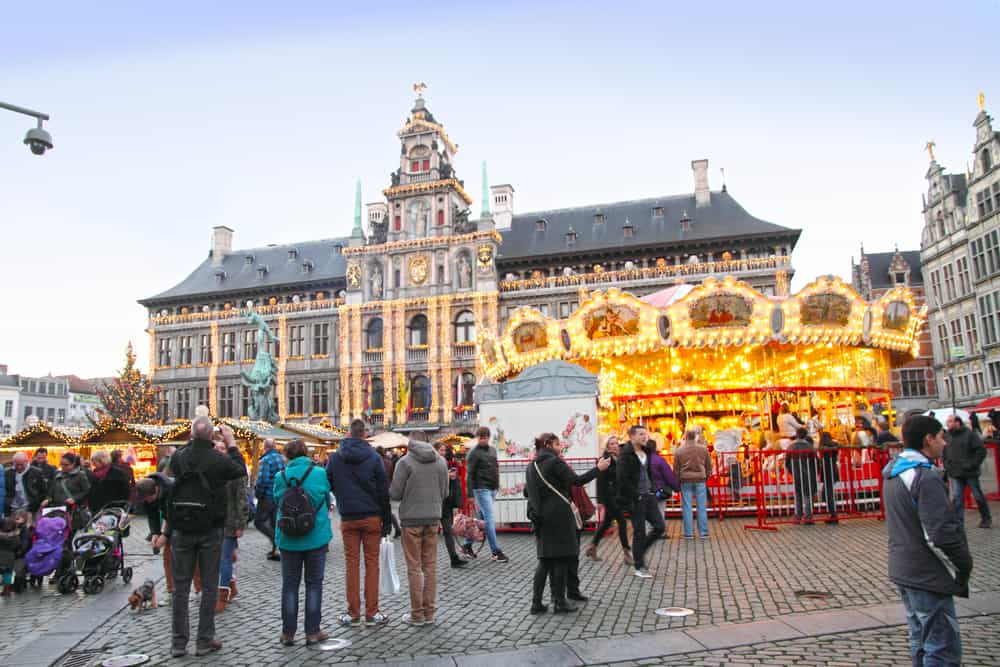 The Christmas market of Antwerp is quaint but still draws crowds with its Christmas lights and decor 