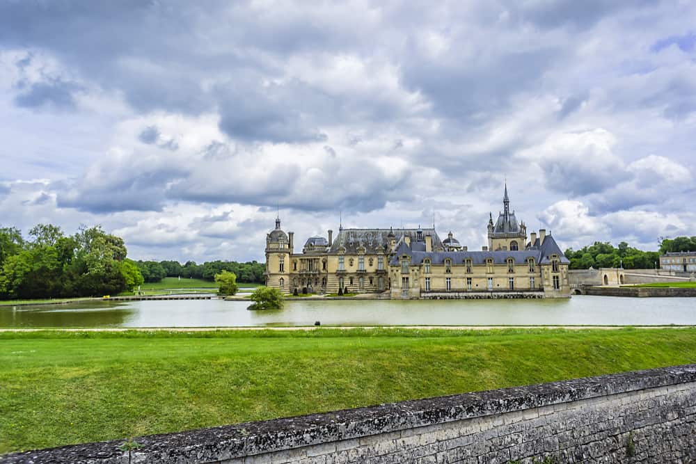 The beautiful Chateau de Chantilly in Chantilly, stop 10 on your France road trip