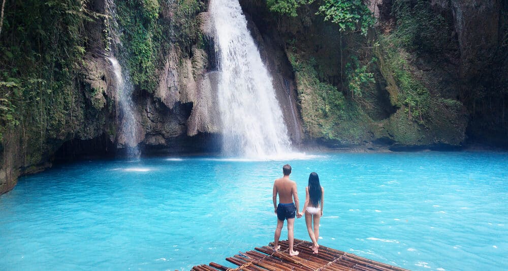 Photo of couple at waterfall, just like you on your Hawaii Honeymoon