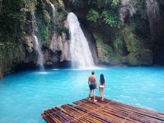 Photo of couple at waterfall, just like you on your Hawaii Honeymoon