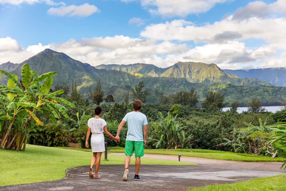 Photo of a couple who could be experiencing a Hawaii honeymoon at Hanalei Bay