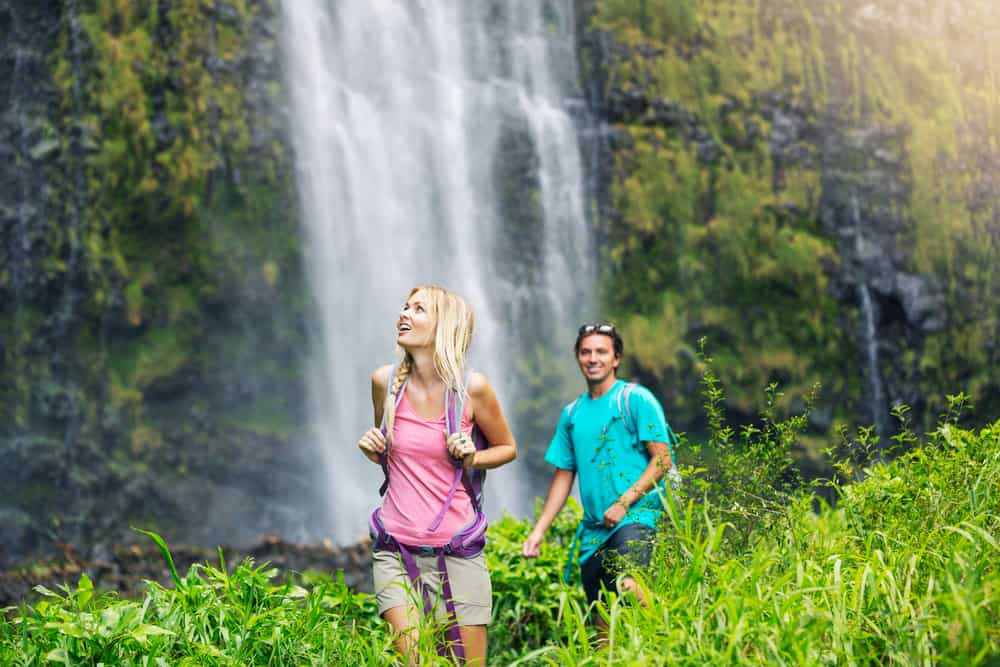 Photo of couple doing a waterfall hike together