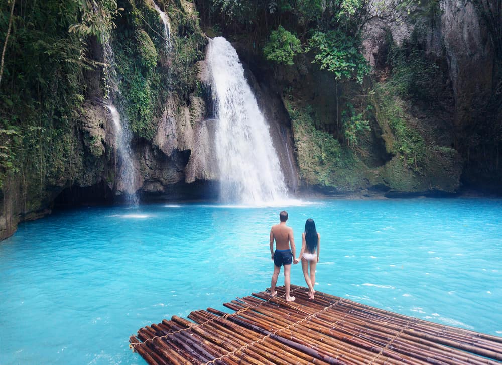 Photo of couple at waterfall, just like you on your Hawaii Honeymoon