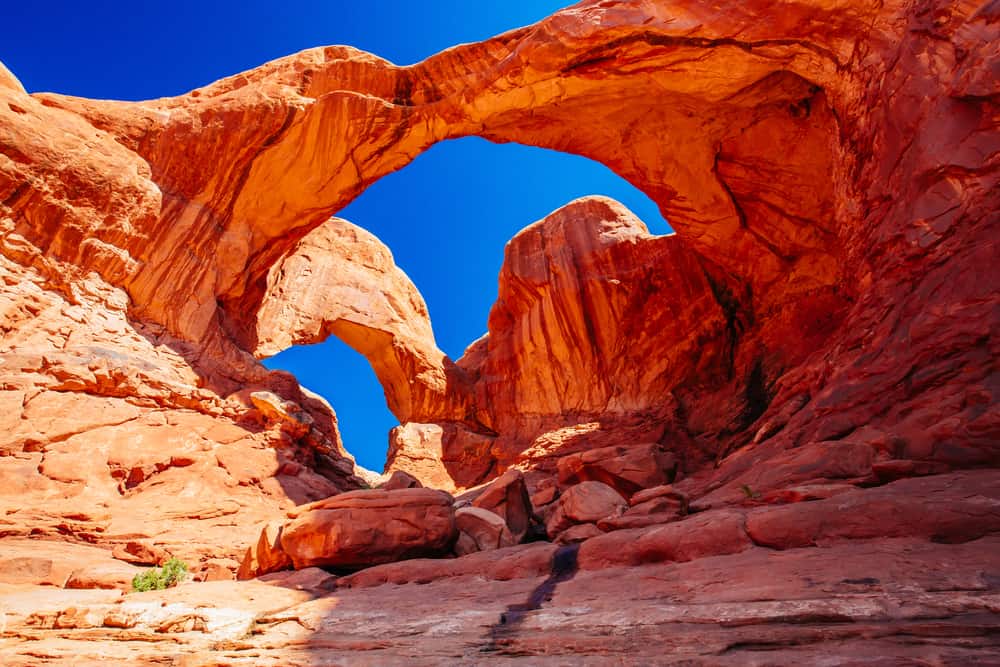 Double Arch is one of the best Arches National Park hikes to go on at sunrise