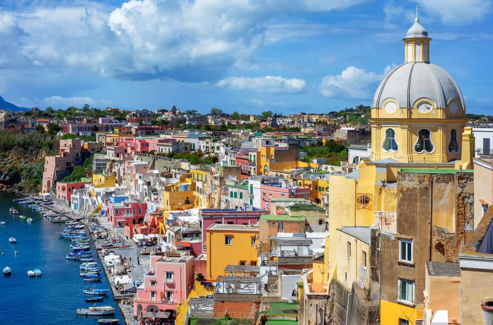 small town in italy on the coast with colorful buildings