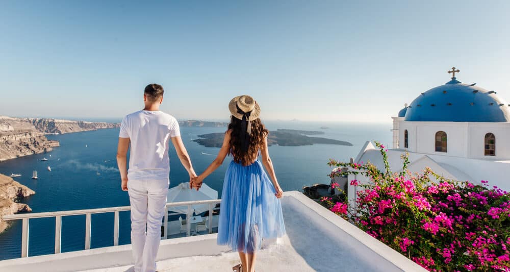 Photo of a couple in Greece, like you and your lover soon will be on your Greece honeymoon.