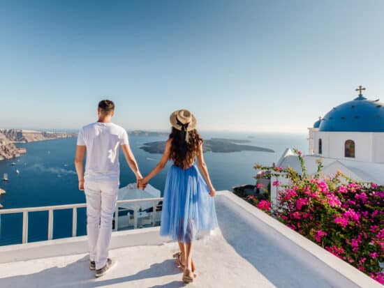 Photo of a couple in Greece, like you and your lover soon will be on your Greece honeymoon.