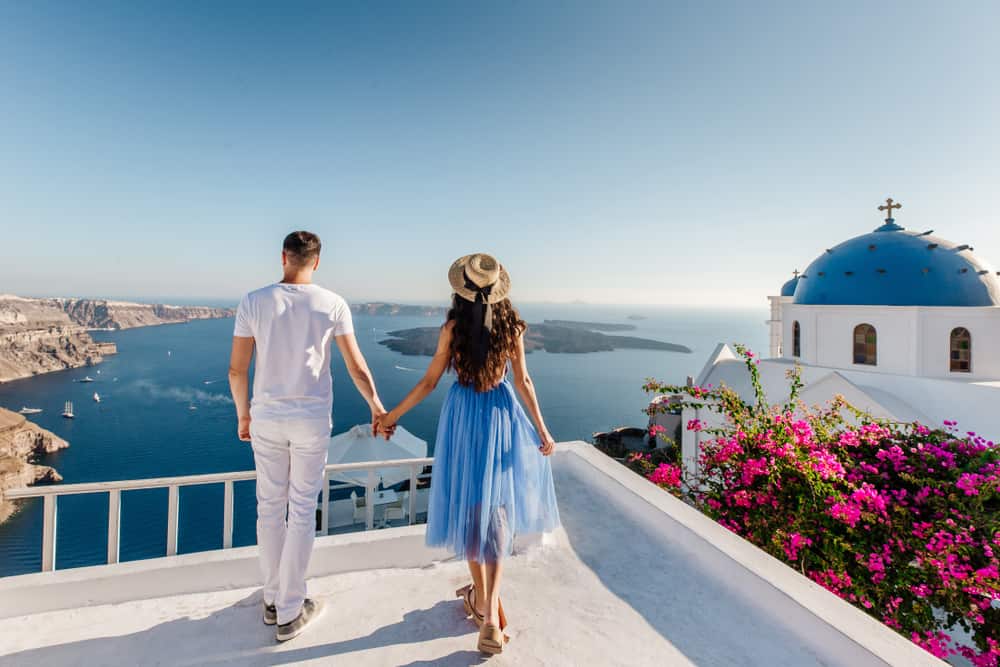 Photo of a couple in Greece, like you and your lover soon will be on your Greece honeymoon.