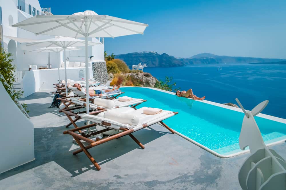 Photo of poolside view that you could experience during your Greece honeymoon.