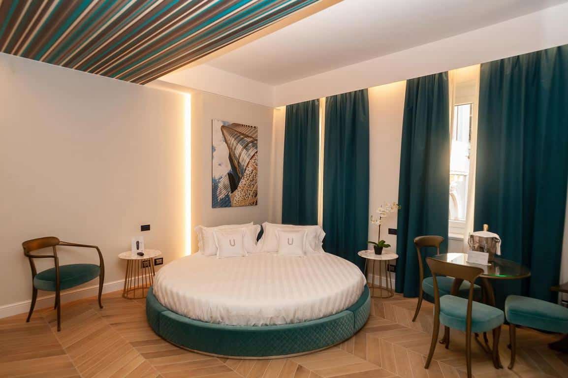 A gorgeous bed in The Unique, a luxury choice of where to stay in Milan