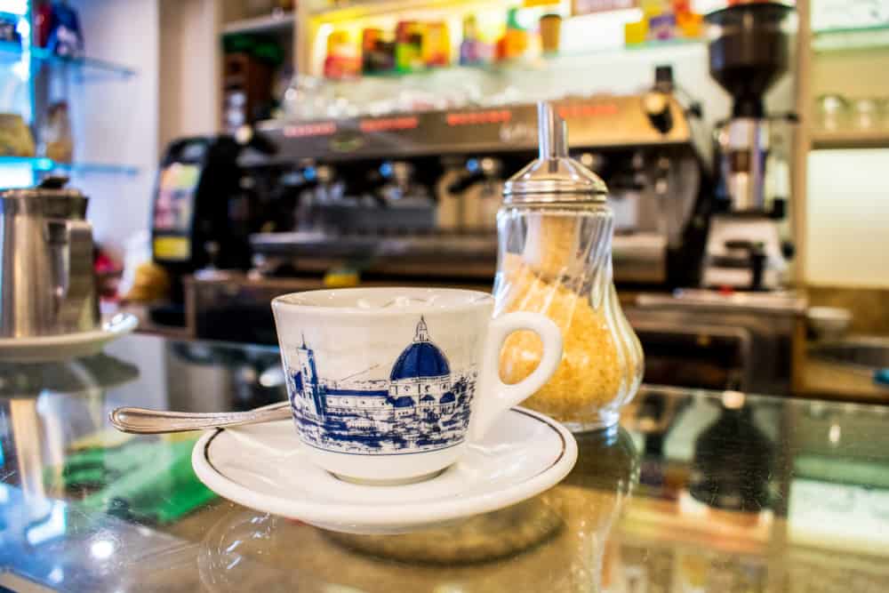 an espresso cup with sugar at an Italian bar in Florence 