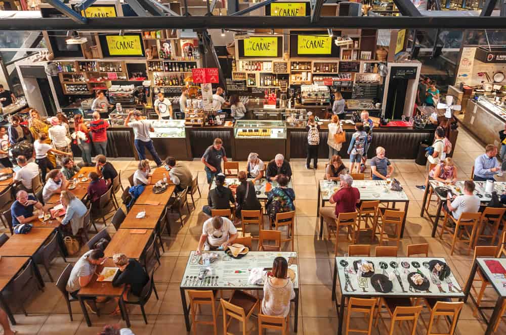 people eating at during a busy time at the mercato centrale in Florence 