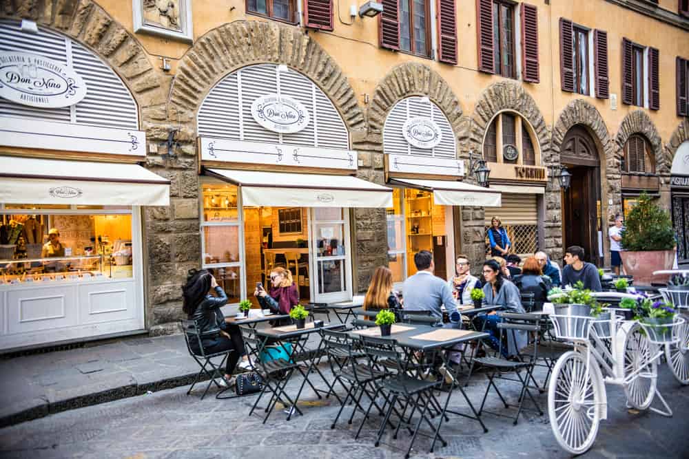 people enjoying a tuscan meal outside in Florence 