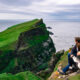 Photo of a couple overlooking cliffs in Ireland.