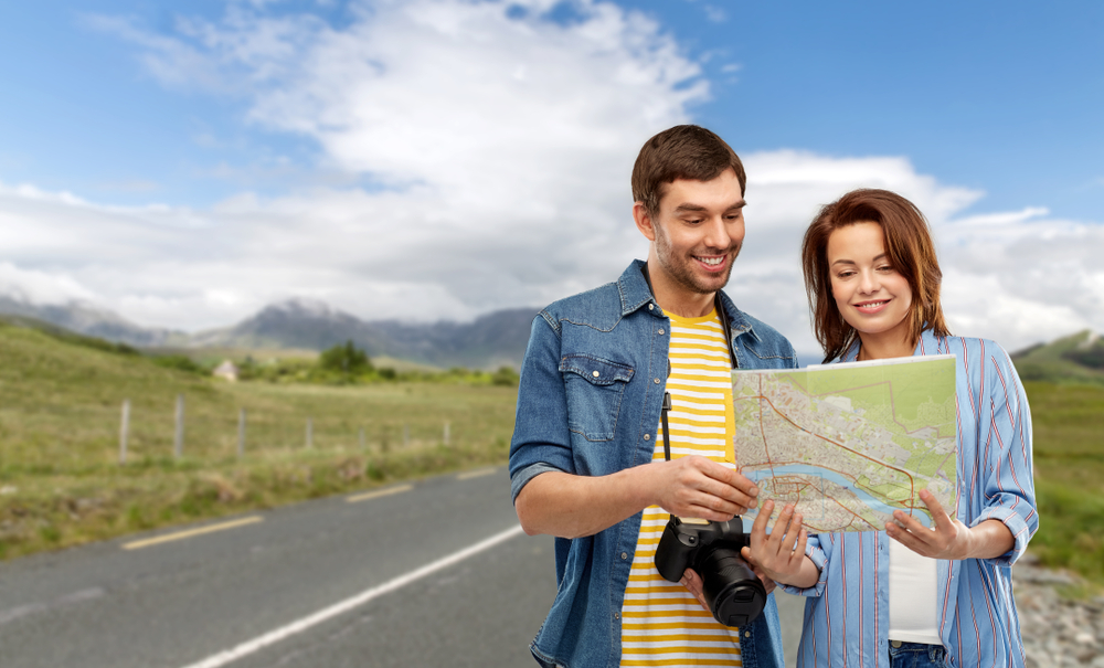 Photo of couple in Ireland with a map.