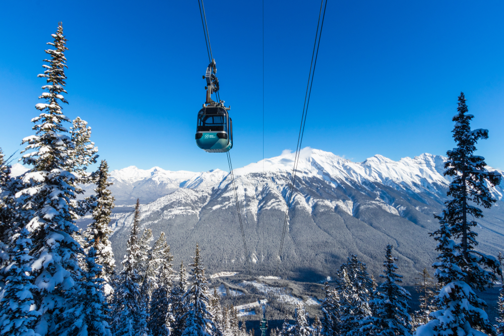 A gondola to Sulphur Mountain with trees covered in snow in Banff in winter!