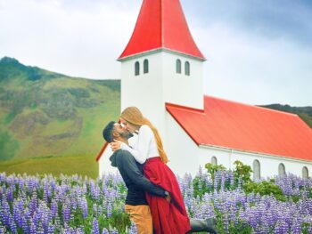 Photo of Victoria and Terrence in front of church in Iceland.