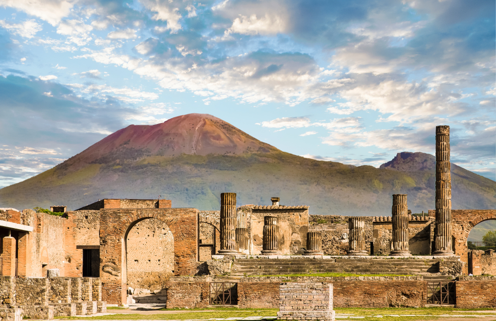 The ruins of Pompeii with Mount Vesuvius looming in the distance during a day trip from Rome.