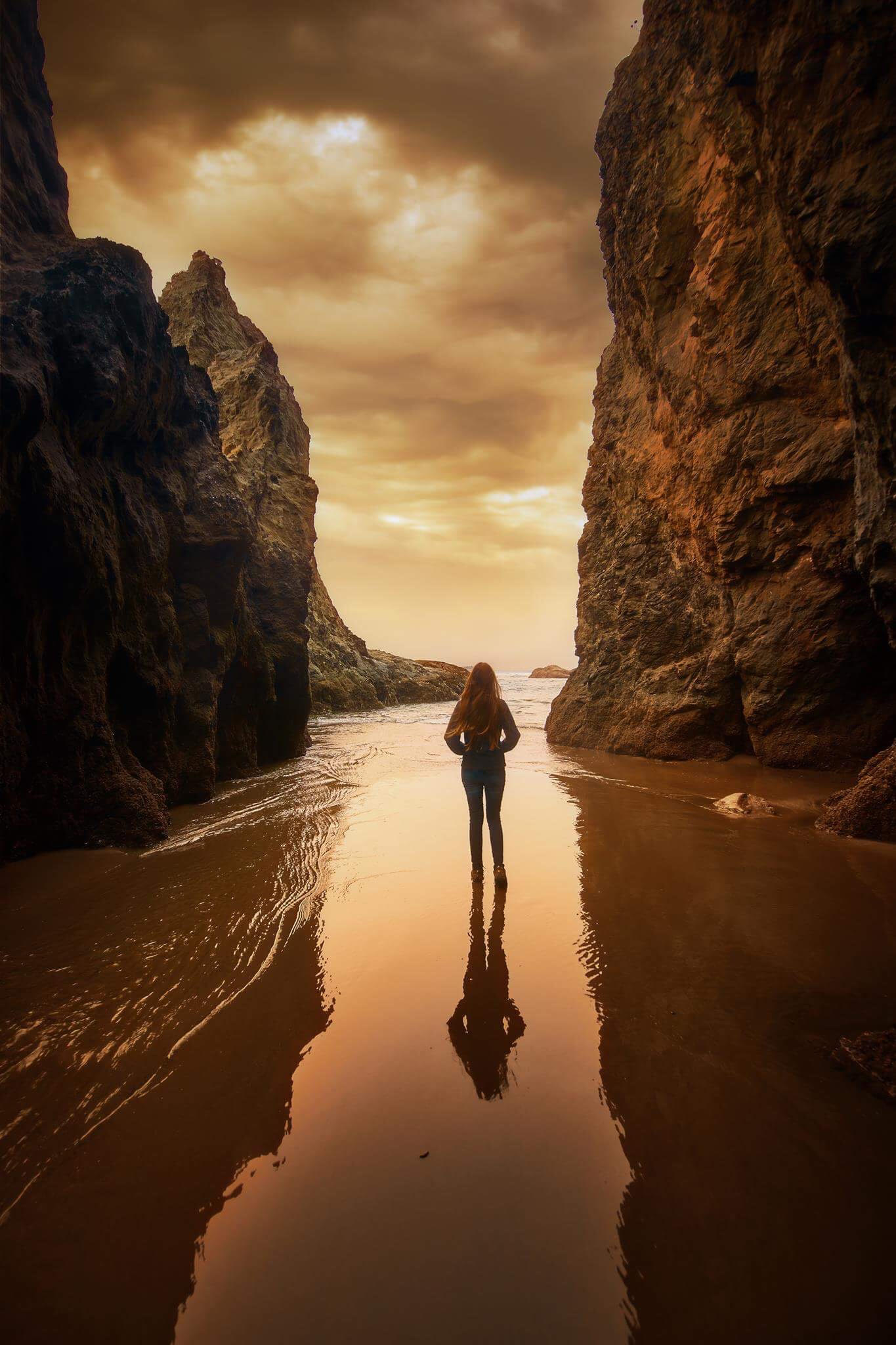 standing on the beach on your Oregon coast road trip