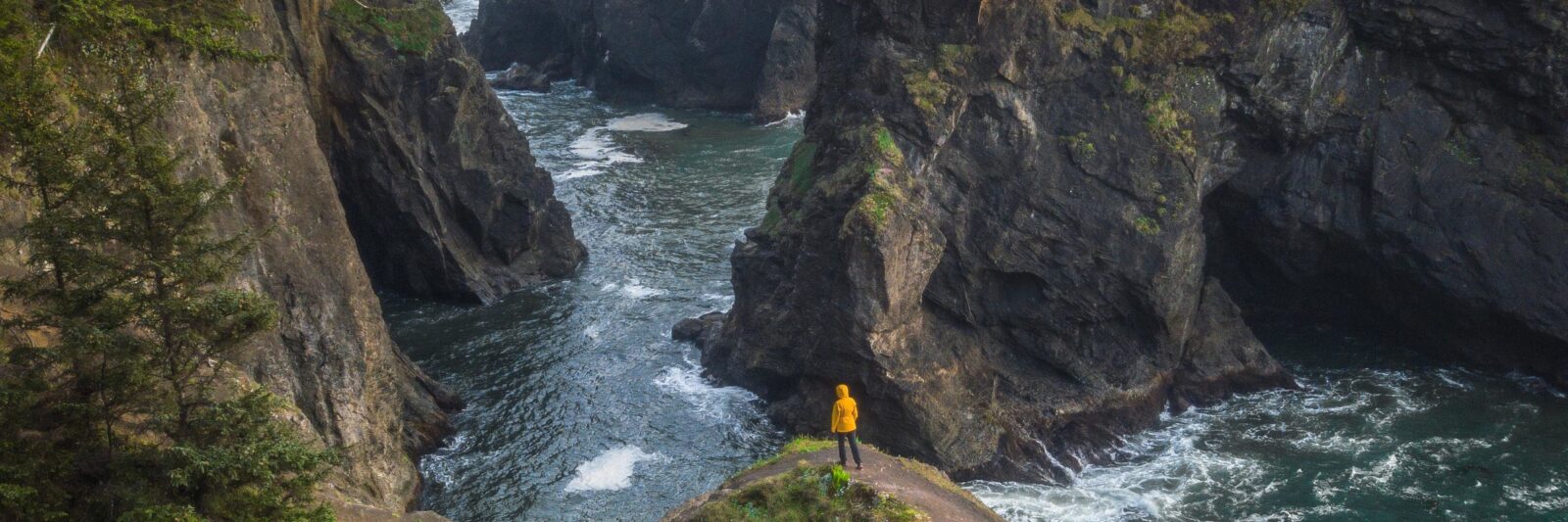 walking on a natural bridge at the Samuel H Boardman Scenic Corridor on your Oregon coast road trip