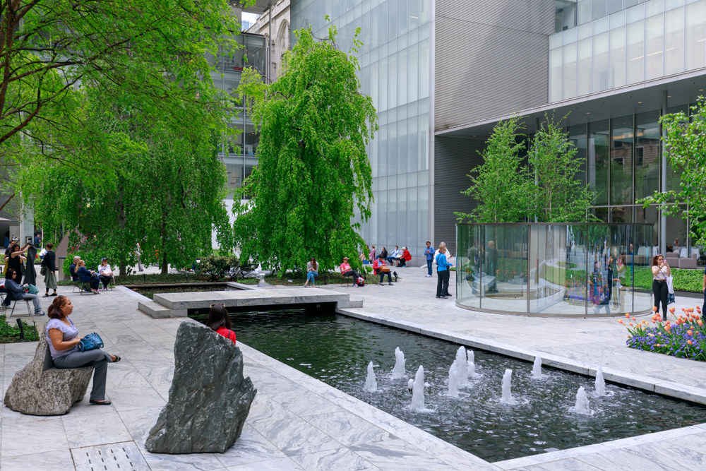 Museum goers in the main gardens of the Museum of Modern Art