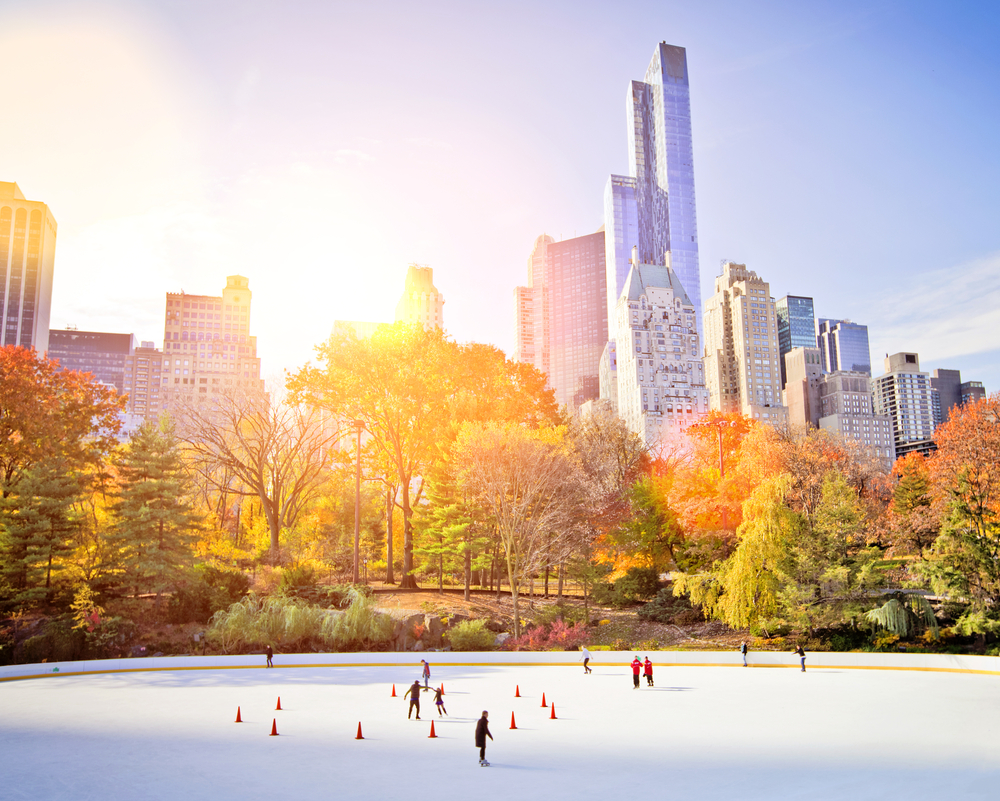 People ice skating on a winter morning