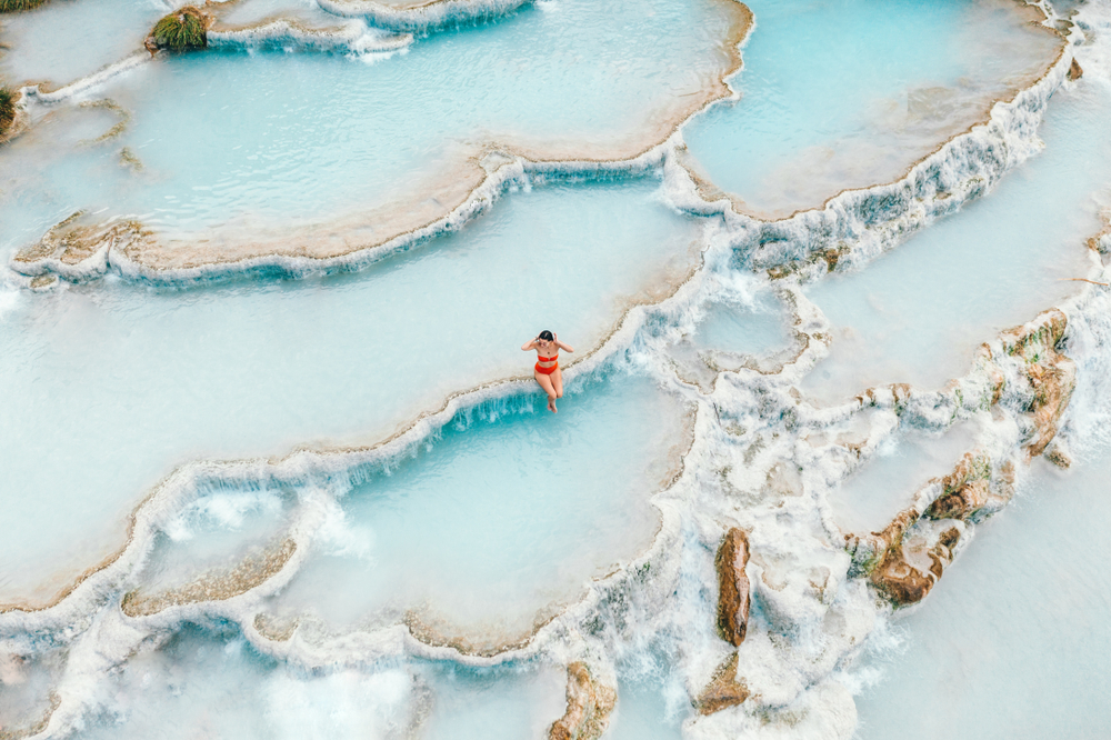 aerial view of natural hot spring with girl