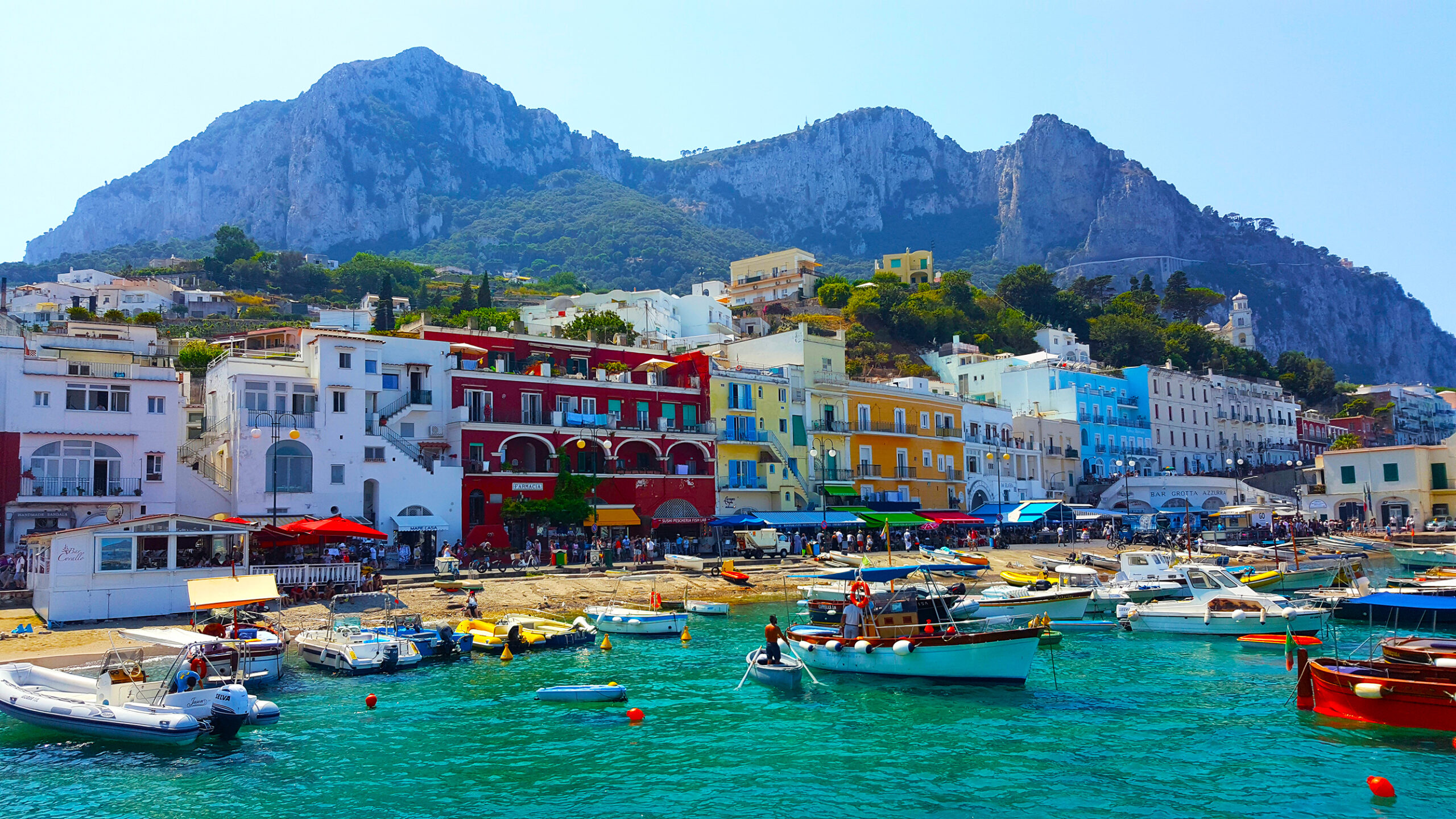 Photo of Marina Grande of Amalfi showing fishing boats and colorful buildings.