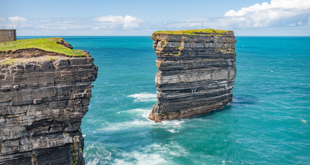 Sea stack at Downpatrick Head on a clear day in Ireland.