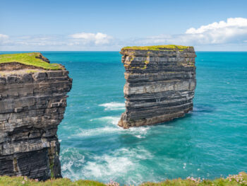 Sea stack at Downpatrick Head on a clear day in Ireland.