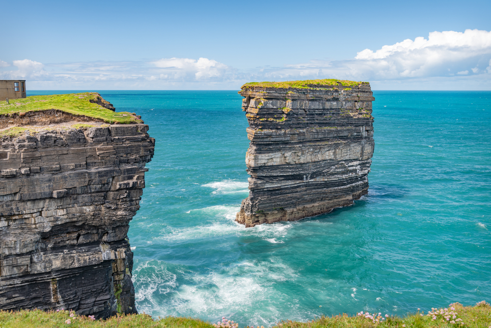 Sea stack at Downpatrick Head on a clear day in Ireland.