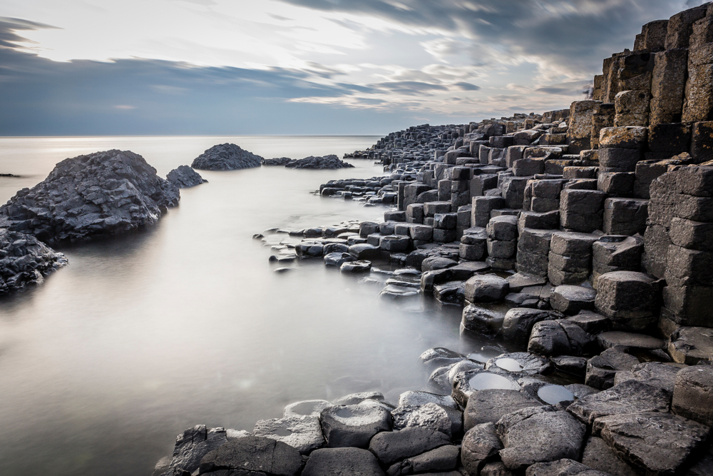 foggy landscape with gray hexagonal rocks day trips from Dublin