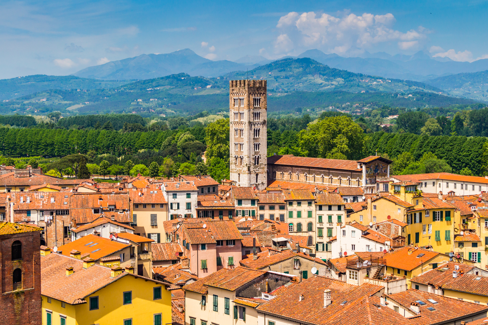 Lucca city with tower and mountains in background