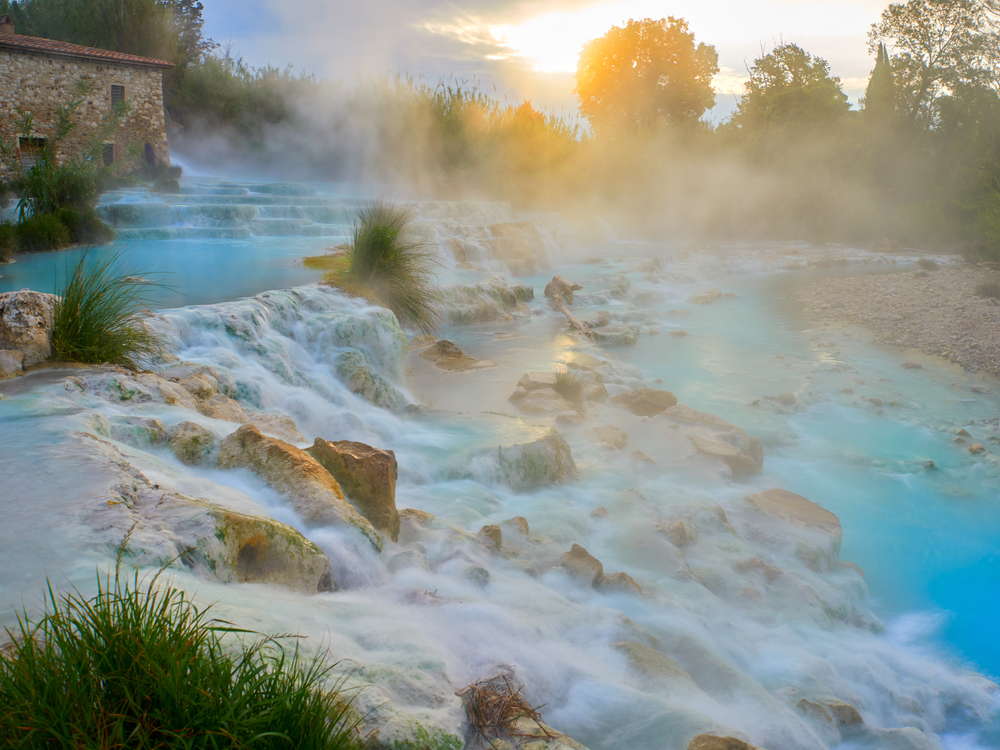 teal steaming waters in hot spring day trips from Florence