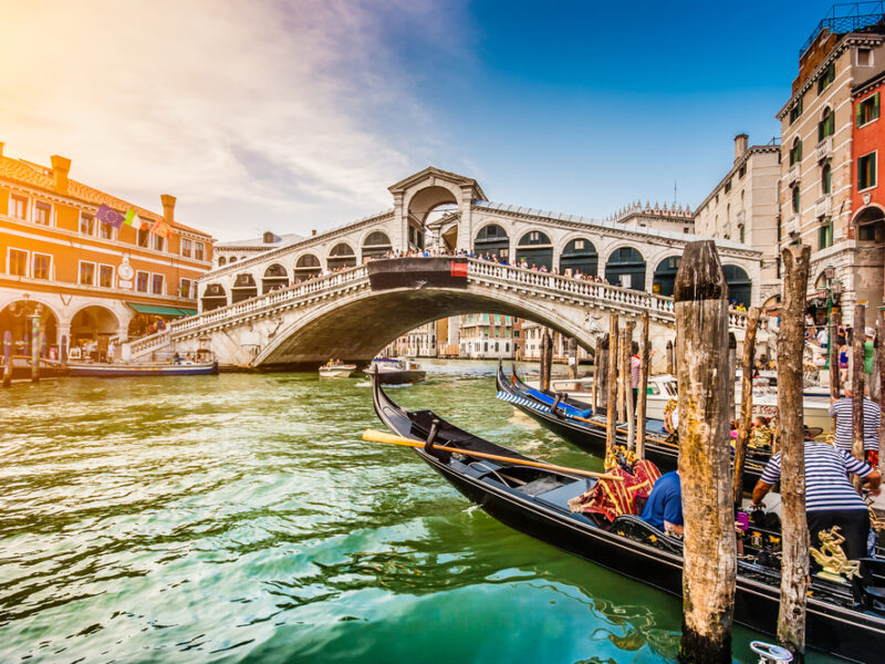 Rialto Bridge and grand canal with gondolas day trips from Florence.