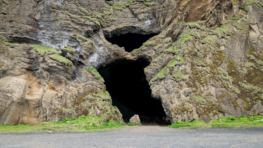 Cave opening at Hjorleifshofdi at a hidden gem in Iceland