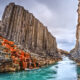 River flowing through the black basalt columns of Studlagil Canyon, one of the hidden gems in Iceland