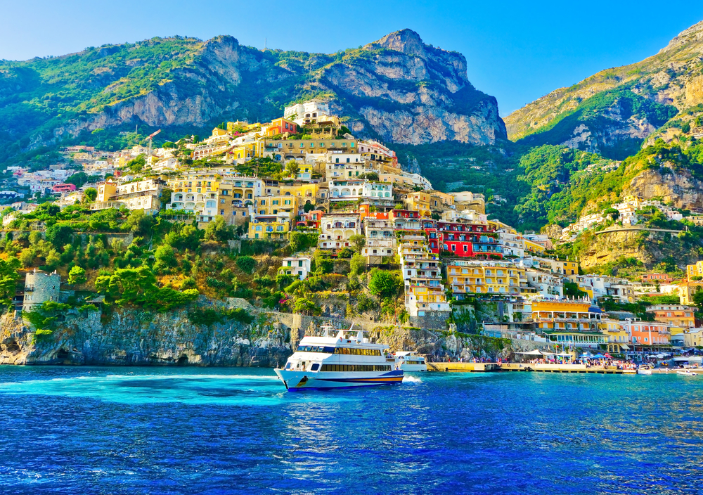 Coastal view of Positano, showcasing the steep hillside of the one of the prettiest beach towns in Italy.