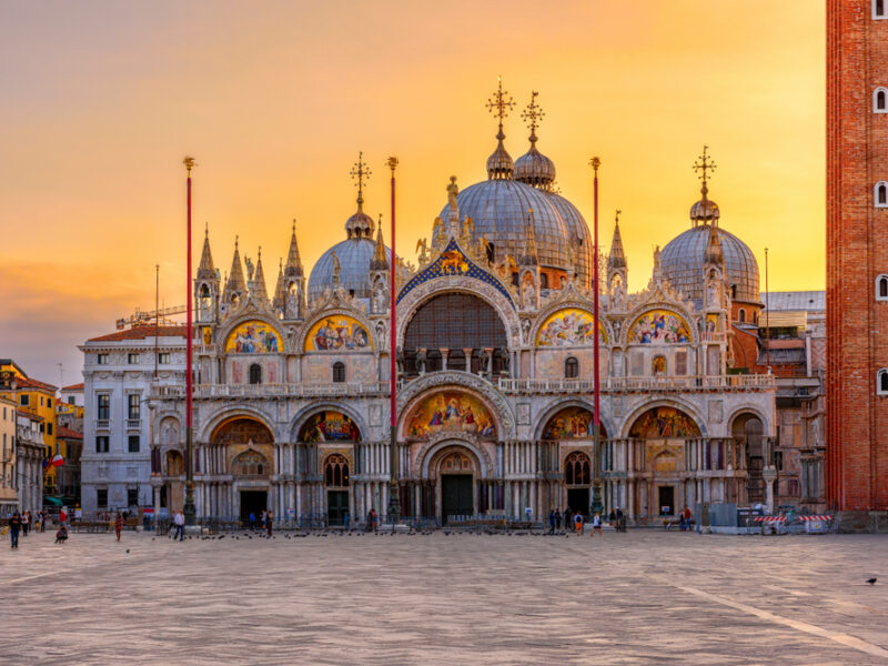 A frontal view of St. Mark's Basilica at sundown in Venice, Italy. 
