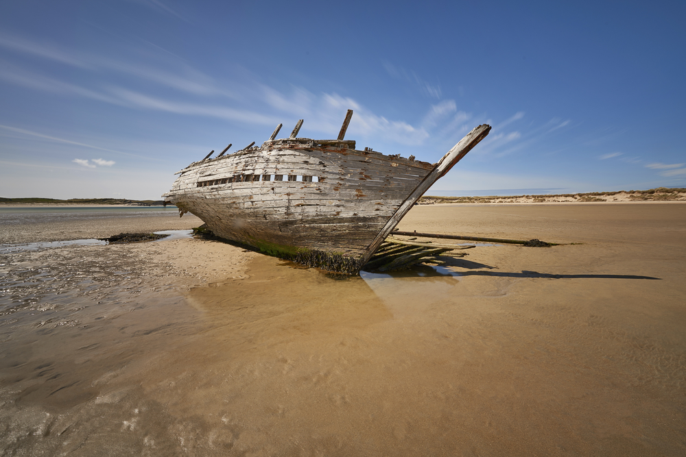 Eddie's Boat shipwreck beached on the sand 