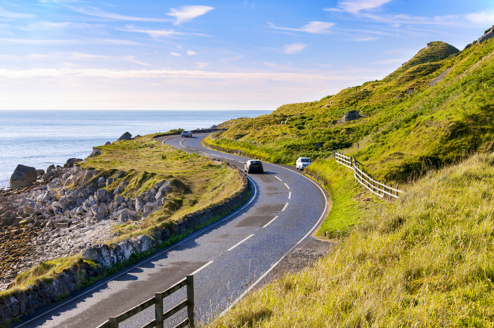 A car driving along coastal Ireland.