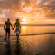 couple enjoying sunset on the beach on their costa rica honeymoon