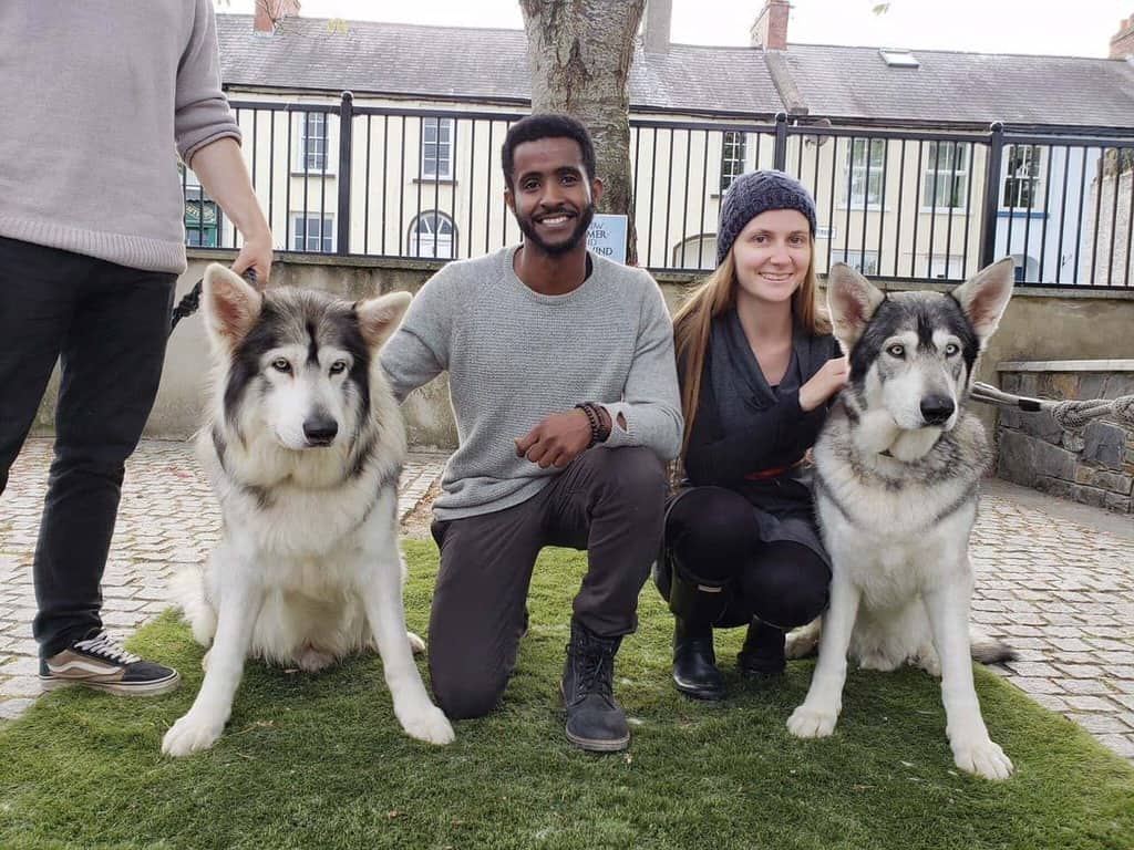 photo of Victoria and Terrence with two of the Game of Thrones Direwolves. 