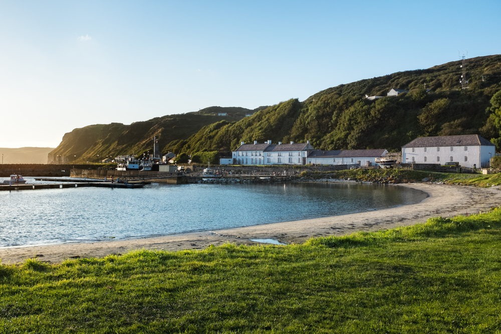 photo of the bay of Rathlin Ireland. There are buildings in the background.