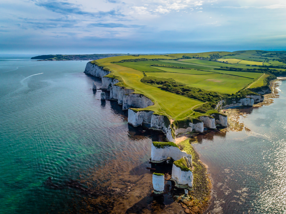 a drone photo of Old Harry Rocks, a natural chalk formation located off the Dorset coast in southern england